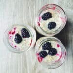 blackberry high protein overnight oats in mason jars