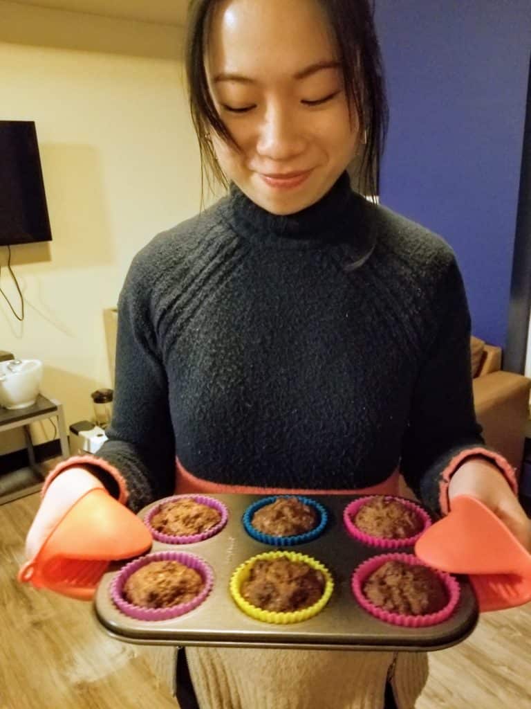 annika holding homemade morning glory muffins