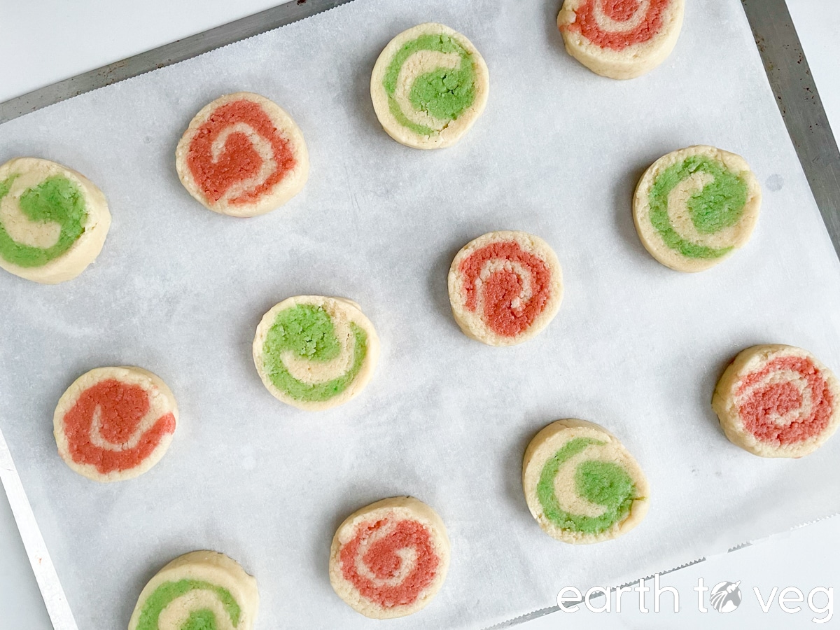 Sliced icebox cookies a on sheet before baking.