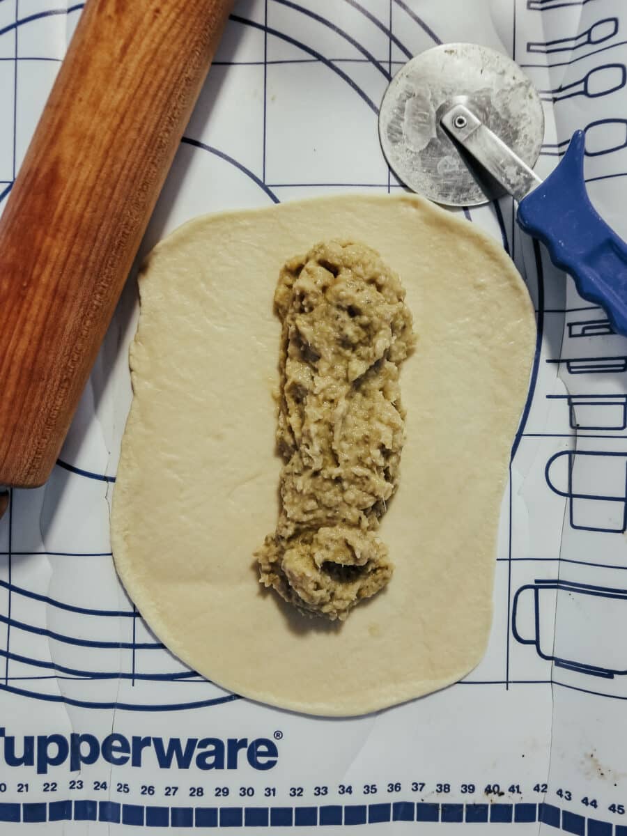 rolling out dough for goldfish in a blanket