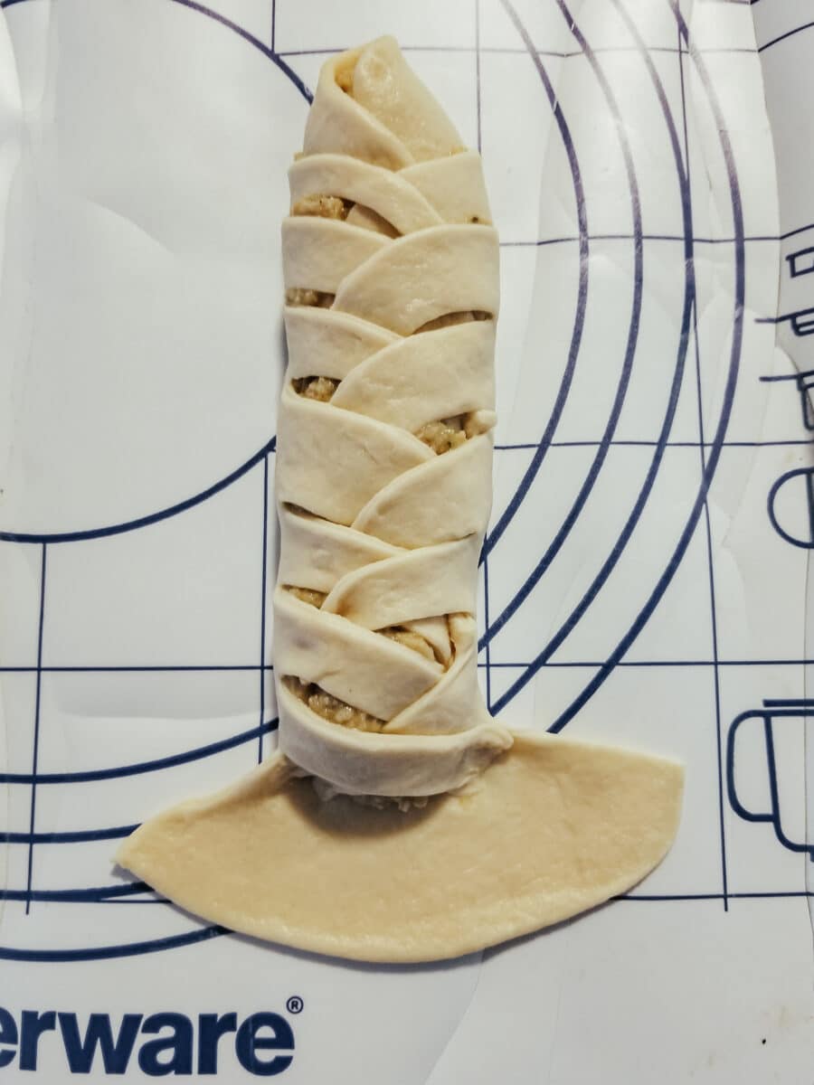 wrapping and plaiting crescent roll dough for goldfish in a blanket