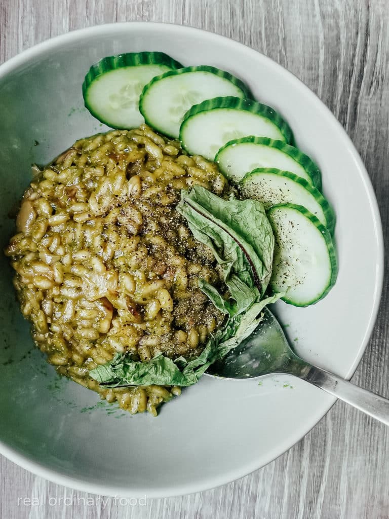 green dandelion risotto with cucumber slices