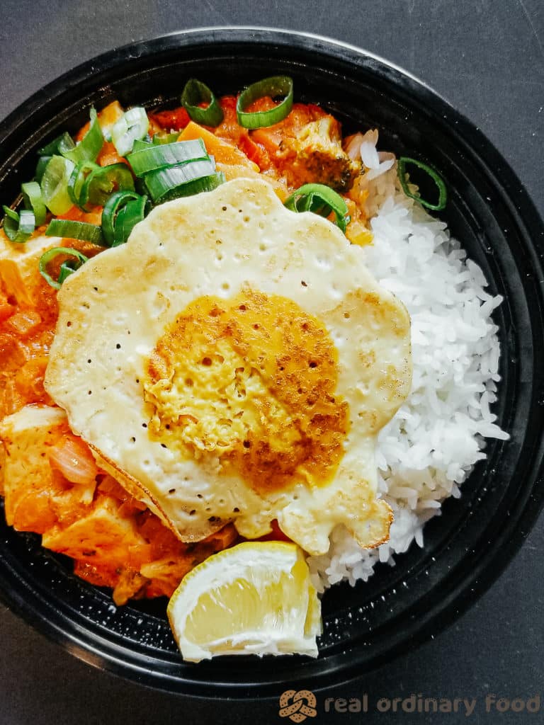 vegan fried egg over thai red curry