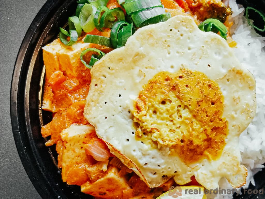 vegan fried egg over thai red curry