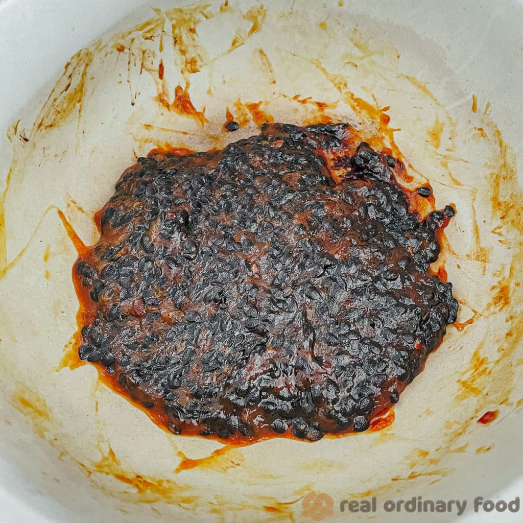reducing passion fruit butter on the stove