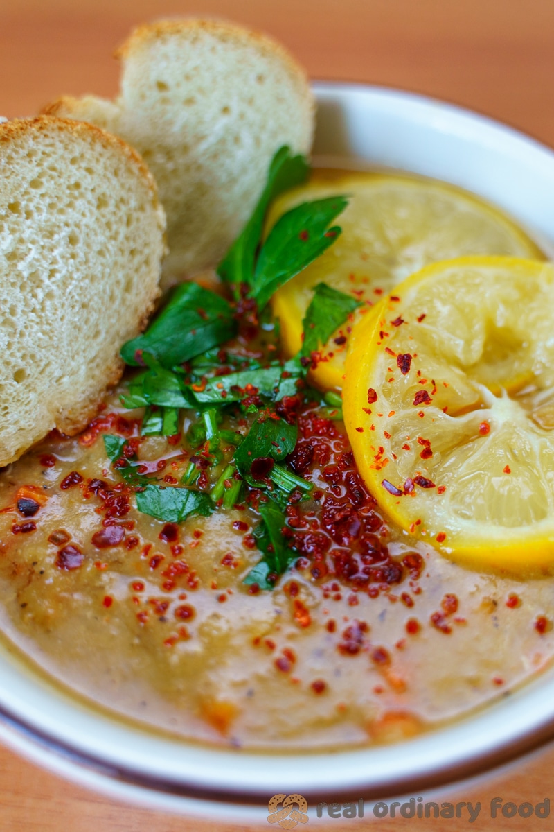 turkish lentil soup with crusty bread and lemon slices