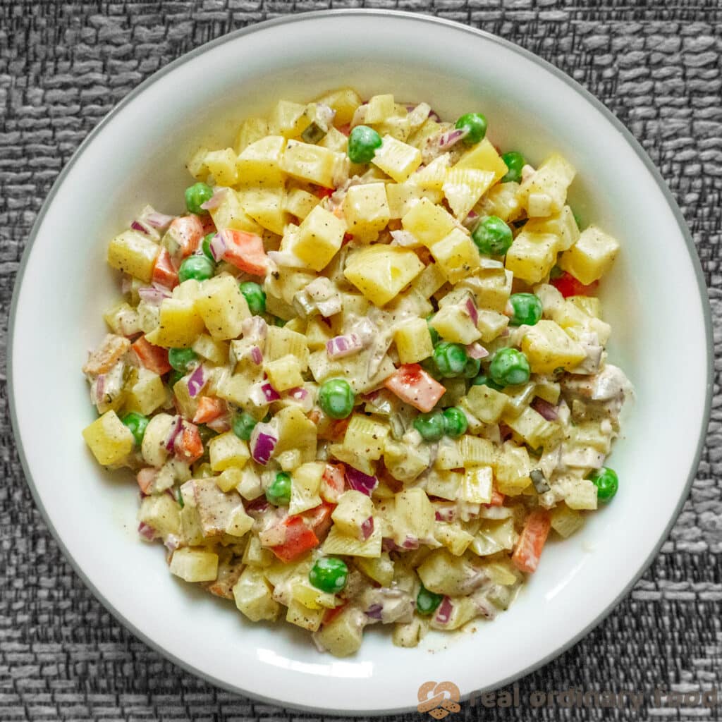 big bowl of vegan salad olivieh