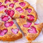 Strawberry yogurt cake is sliced into wedges.