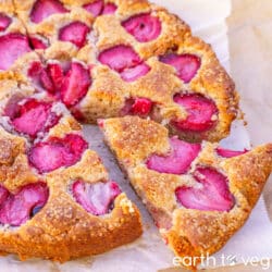 Strawberry yogurt cake is sliced into wedges.