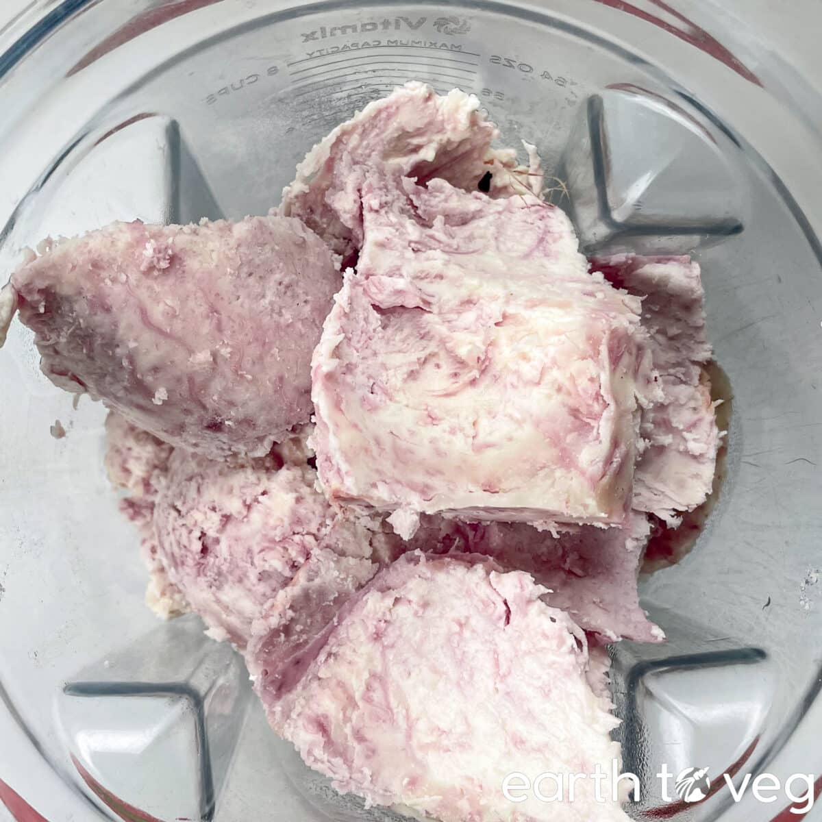 Taro and coconut milk are in a Vitamix blender.