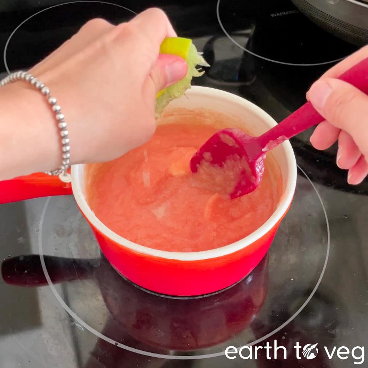 Lime juice is squeezed into the pie filling.
