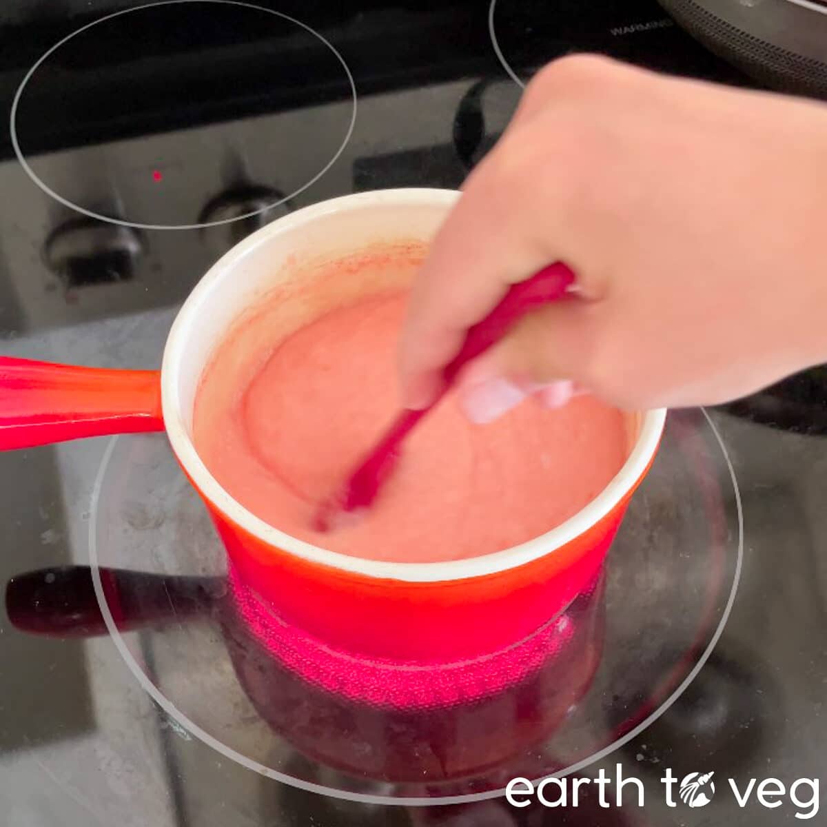 Pineapple puree stirred with a small silicone spatula.