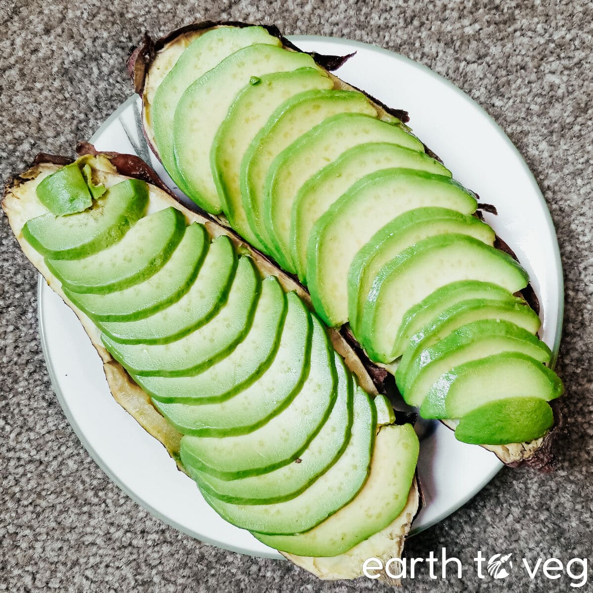 sliced avocados on japanese sweet potatoes