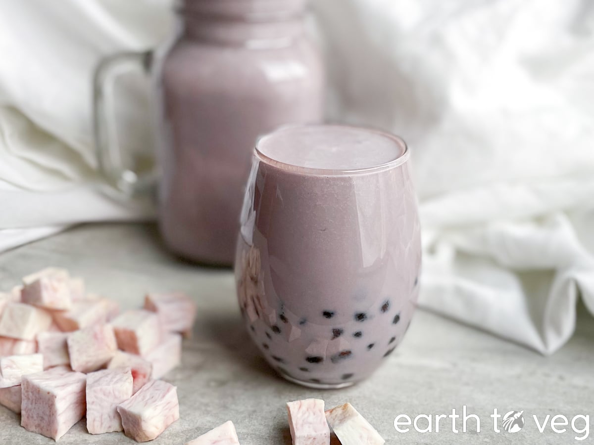 Vegan taro bubble tea in a glass.