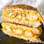 tater tot melt sliced in half on a cast iron skillet