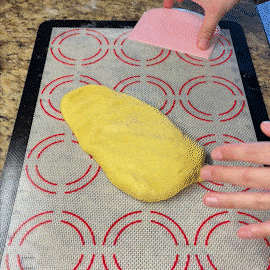 dough is rolled up into three swirled rolls.