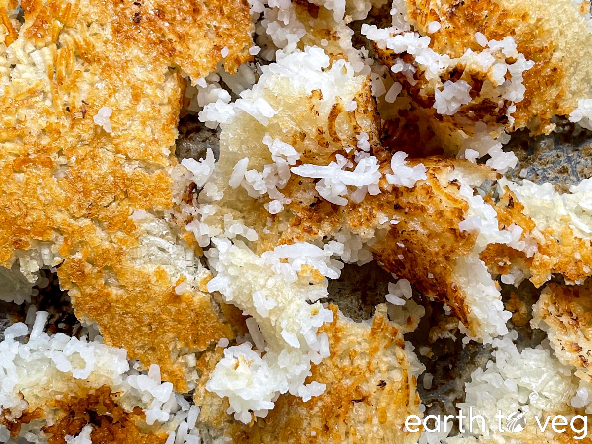 Big pieces of golden-brown scorched rice at the bottom of a steel pot.