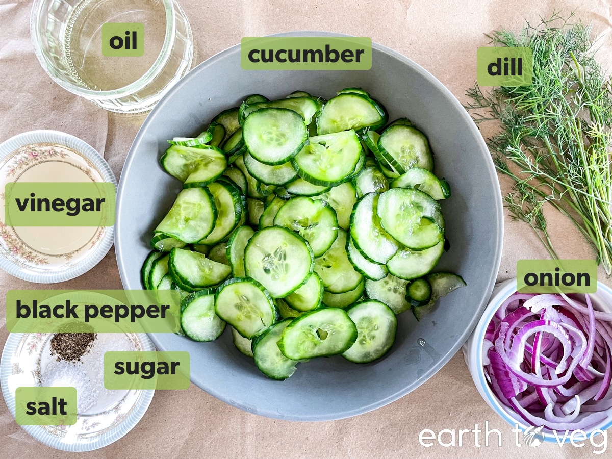 German cucumber salad ingredients placed on brown paper.
