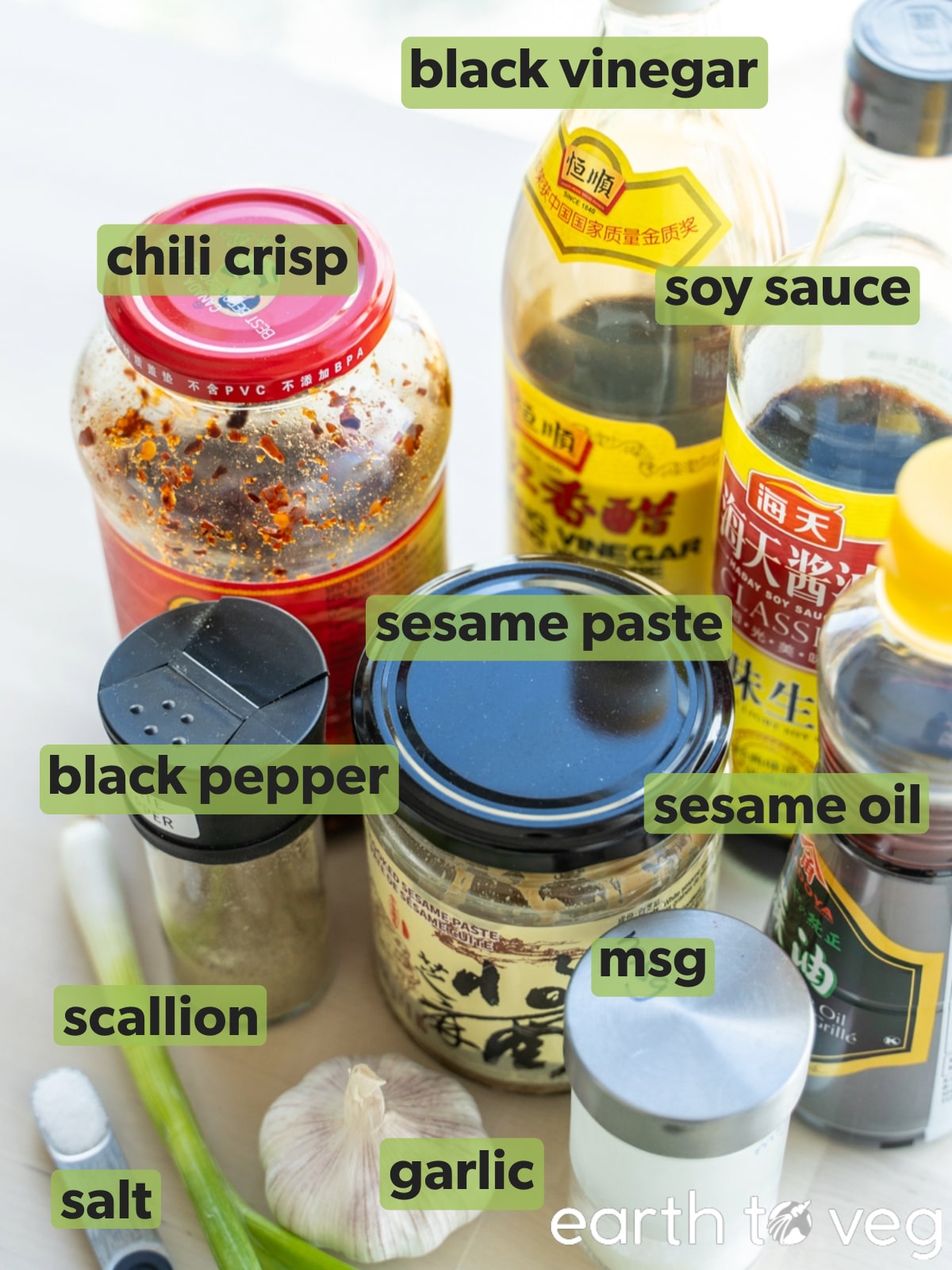 Ingredients for hot pot dip on a light wooden table.