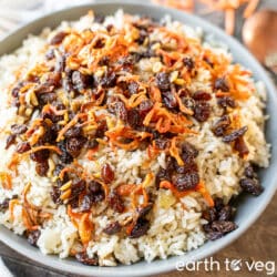 Vegetarian Kabuli Palaw piled up on a large grey plate.