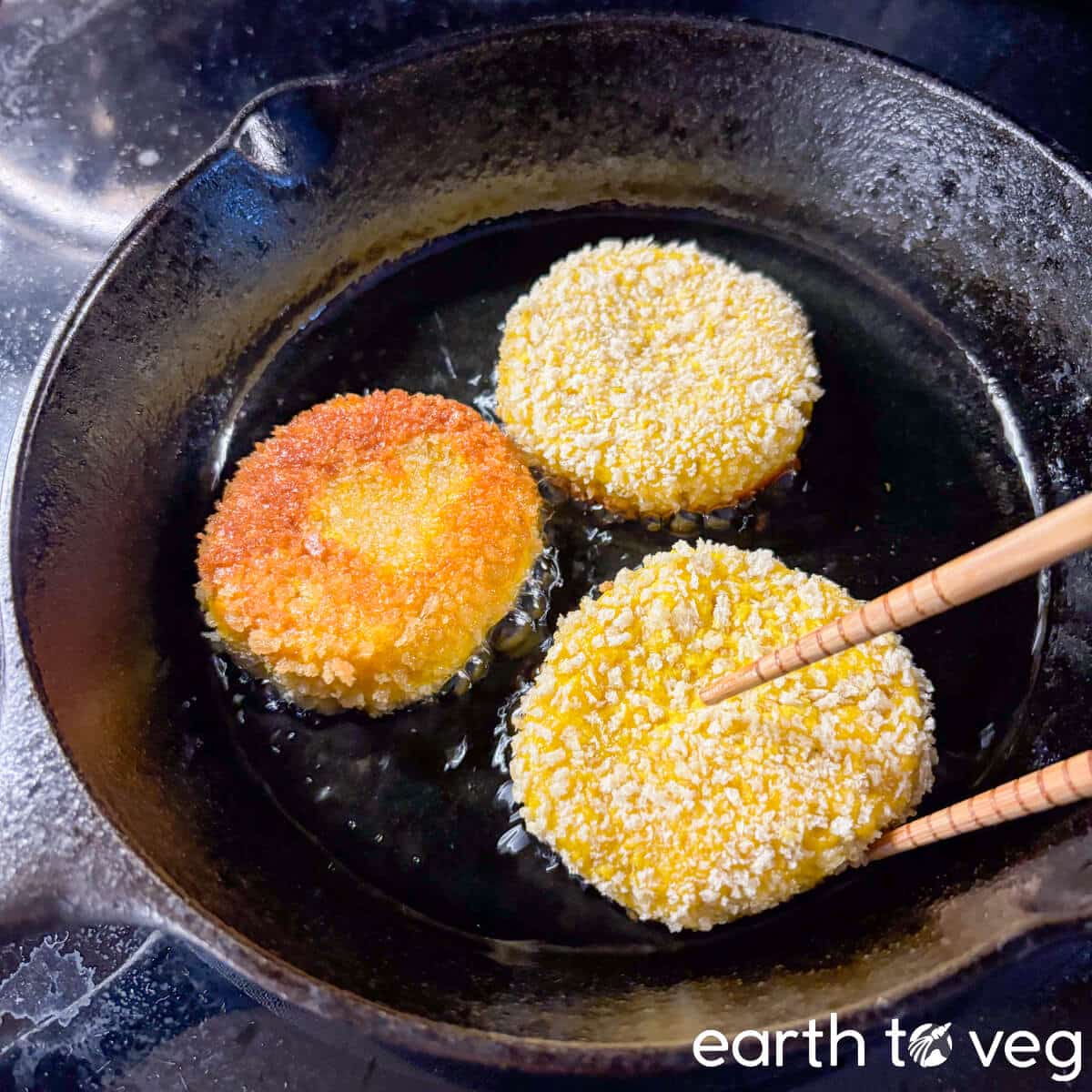 The pumpkin cakes are shallow fried in batches in a cast iron skillet.