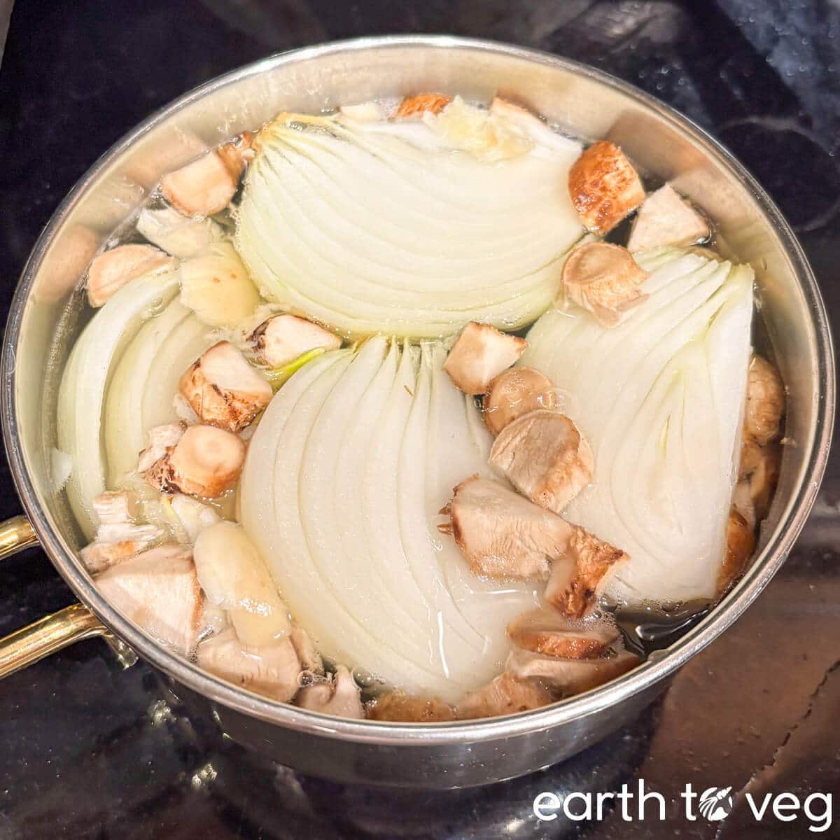 Shiitake mushroom stems are simmered with onion and garlic to make the mushroom soup stock.