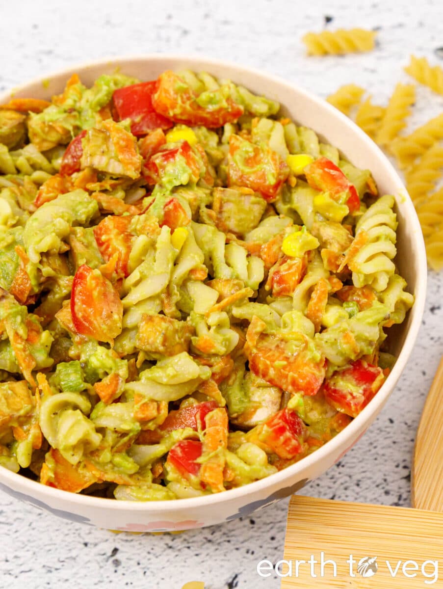 A bowl of avocado tofu pasta salad.