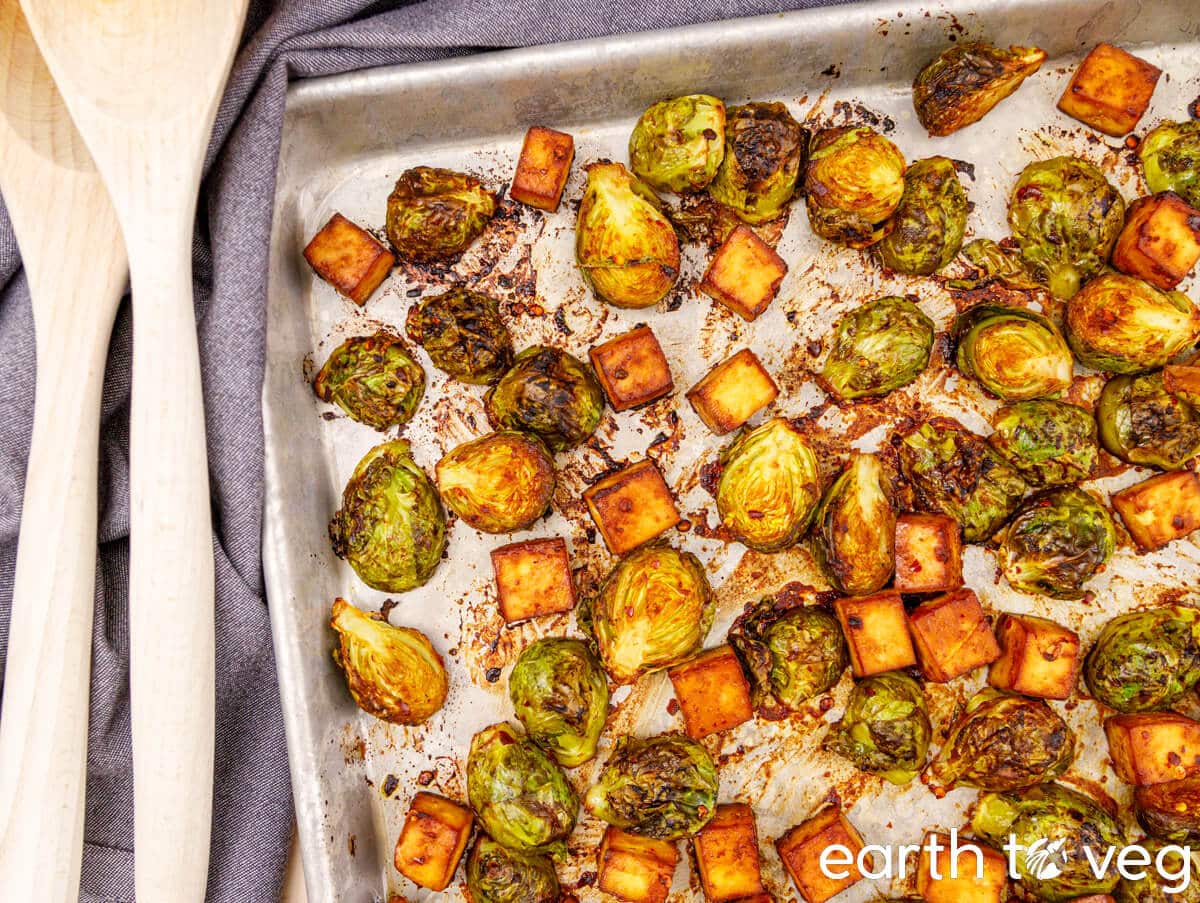 A sheet pan full of roasted miso tofu and brussels sprouts.