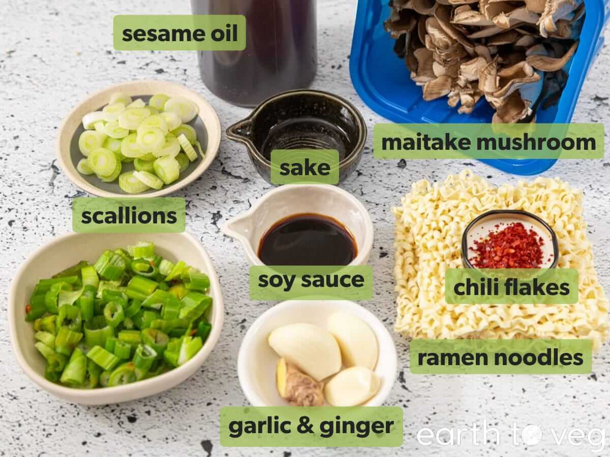 Ingredients for mushroom ramen laid out on a white countertop.