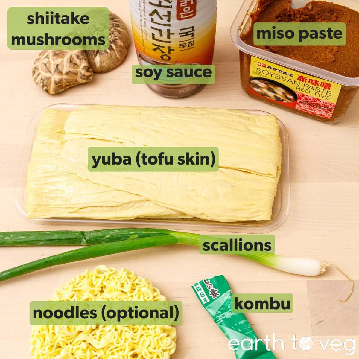 Ingredients for yuba soup on a wooden countertop.