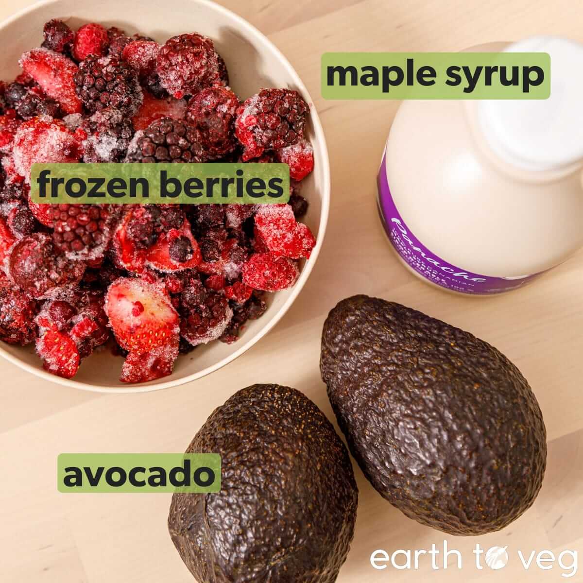 Ingredients for avocado ice cream on a wooden table top.