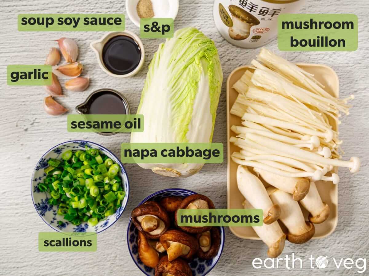 Ingredients for napa mushroom soup with napa cabbage, mixed mushrooms, scallions, garlic, soy sauce, sesame oil, mushroom bouillon, salt and white pepper.